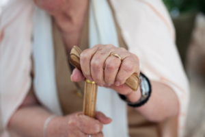 elderly woman with walking stick