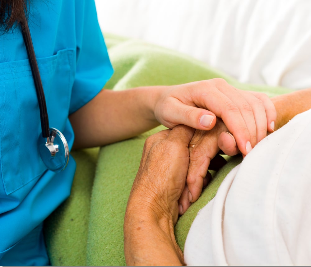 Health,care,nurse,holding,elderly,lady's,hand,with,caring,attitude.