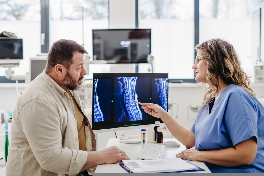 Doctor,consulting,with,overweight,patient,,discussing,test,result,and,x Ray